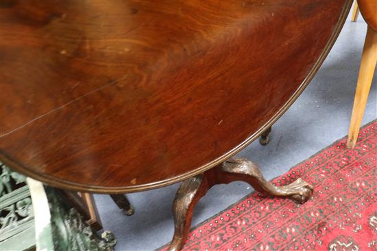 A George III mahogany tea table, with dished top and acanthus carved tripod, W.85cm